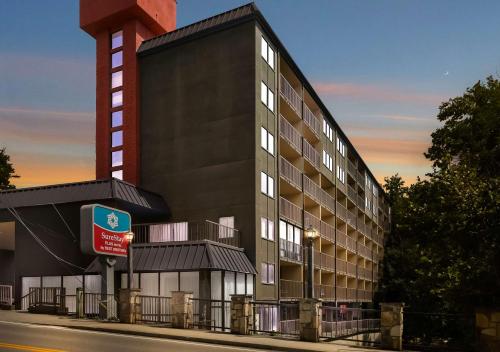 a building on a street with a building at SureStay Plus Hotel by Best Western Gatlinburg in Gatlinburg
