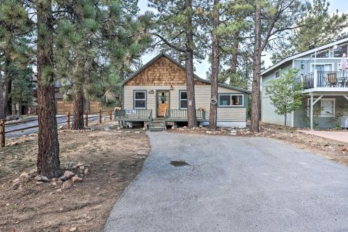 a home with a driveway in front of a house at Peaceful Big Bear Cabin Walk to Lake Access! in Big Bear Lake