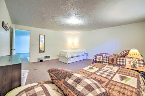 a bedroom with two beds in a room with a bed sqor at Idaho Falls Townhome about 5 Mi to Tauthaus Park! in Idaho Falls