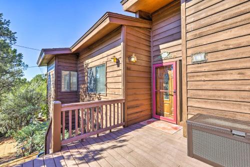 a wooden house with a porch and a deck at Mountain-View Deck Bright Sedona Home in Sedona