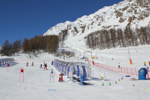 a group of people skiing on a snow covered mountain at Haus Musella in Samnaun