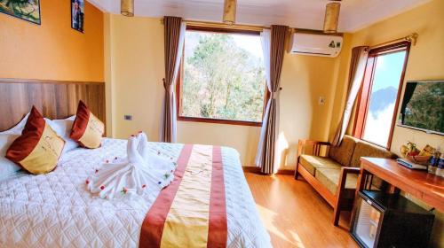 Postel nebo postele na pokoji v ubytování Heart Of Sapa Hotel