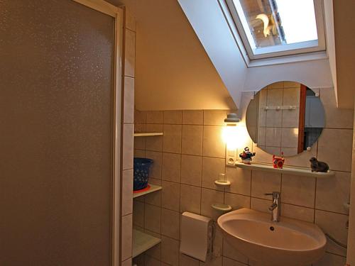 a bathroom with a sink and a window at Gîte Le Val-d'Ajol, 2 pièces, 2 personnes - FR-1-589-172 in Le Val-dʼAjol