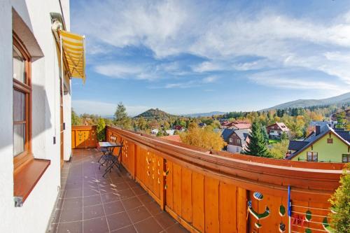 a balcony with a view of the mountains at Centrum Obrońców Pokoju, Sun & Snow in Karpacz