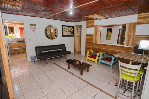 a living room with a couch and a table at Rio Danta in Fortuna