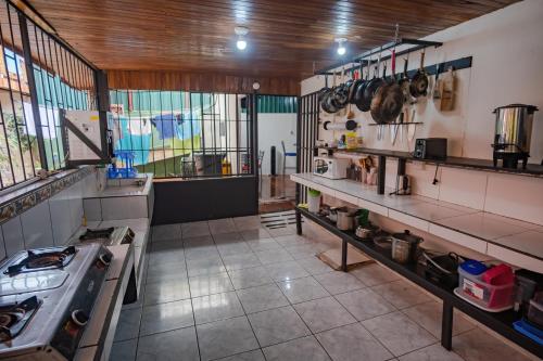 a large kitchen with a stove in a room at Rio Danta in Fortuna
