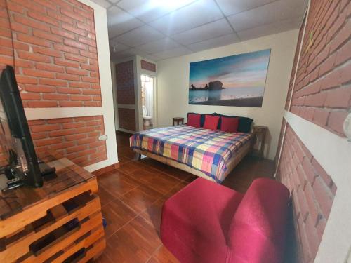 Ένα ή περισσότερα κρεβάτια σε δωμάτιο στο Hostal Las Veraneras Ataco