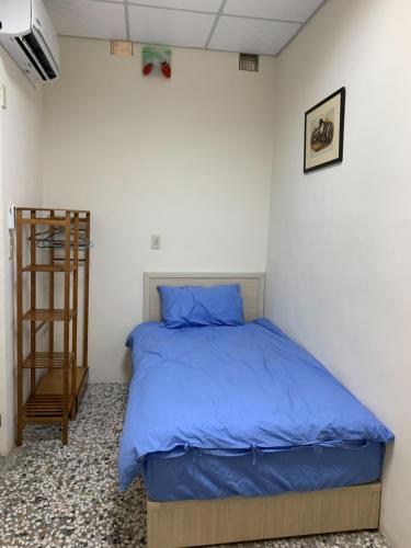 Postel nebo postele na pokoji v ubytování Yataku 雅德背包客舍