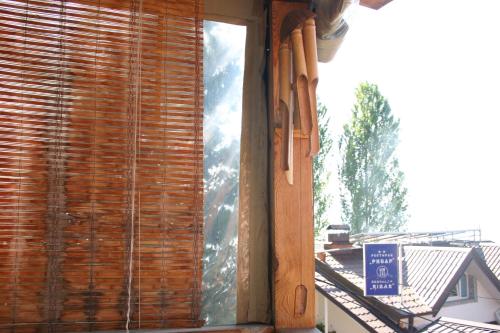a window with a view of a roof at Villa Filip in Trpejca