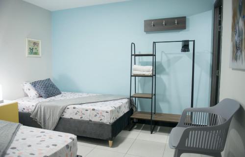 Uma cama ou camas num quarto em Casa Tangara Café y Hospedaje