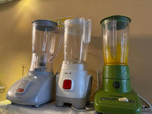 two blenders sitting next to each other on a counter at Escape Backpackers KK in Kota Kinabalu
