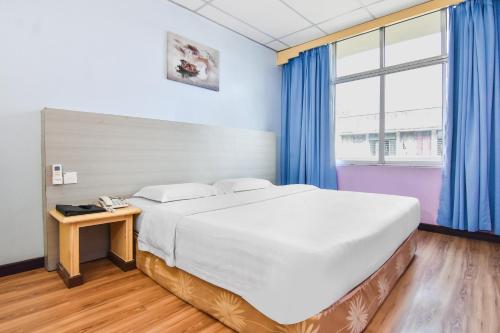 Postel nebo postele na pokoji v ubytování Hotel Hsiang Garden