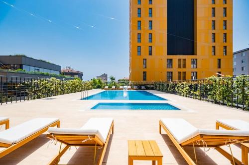 a swimming pool on the roof of a building at Cebeci Residence Pendik in Istanbul