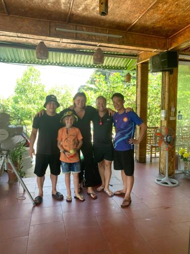 a group of people posing for a picture at Tam Coc Wonderland Bungalow in Ninh Binh