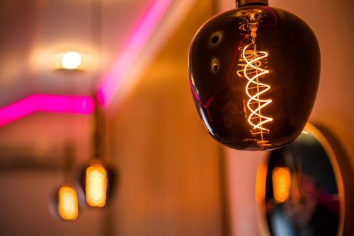 a close up of a glass bottle with lights on it at GLAMOUR - Restaurant & SPA in Przeźmierowo