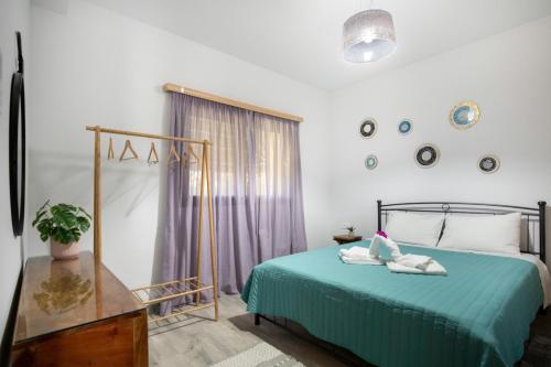 Ένα ή περισσότερα κρεβάτια σε δωμάτιο στο Heliophos Villa Aitheria