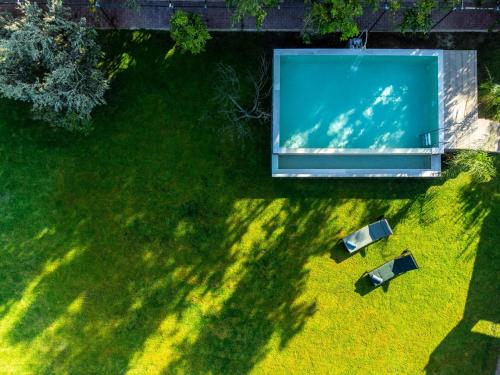 an overhead view of a lawn with a pool at Heliophos Villa Aitheria in Kiotari