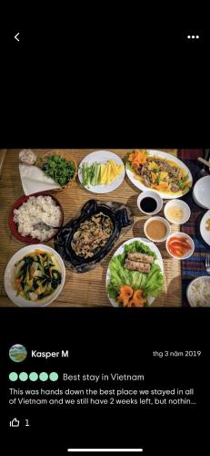 a table with many different dishes of food on it at Tam Coc Wonderland Bungalow in Ninh Binh