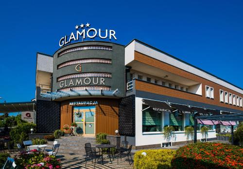 a building with a sign on top of it at GLAMOUR - Restaurant & SPA in Przeźmierowo