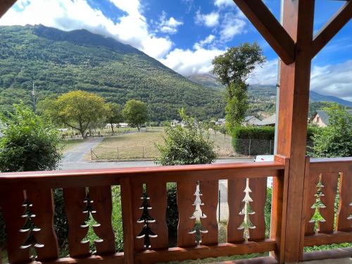 a view from the deck of a house with mountains in the background at Loc luz st sauveur 5 in Luz-Saint-Sauveur