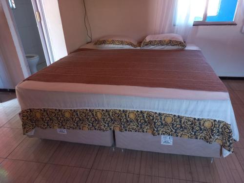 a large bed in a bedroom with at Paracuru HolaOnda WaveHostel in Paracuru