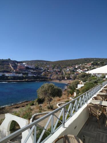 a balcony with chairs and a view of a river at Daskalio Beach Hotel in Keratea