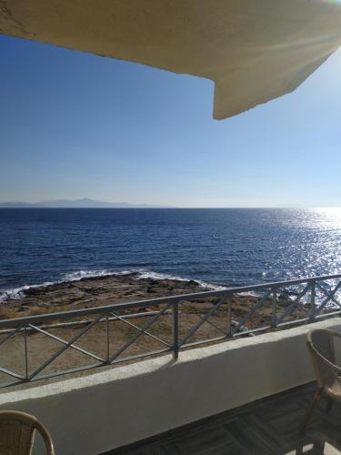 a balcony with a view of the ocean at Daskalio Beach Hotel in Keratea