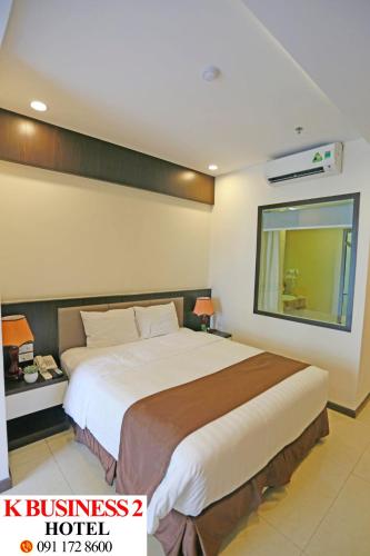 a bedroom with a large bed in a room at K Business 2 Hotel My Dinh 미딩 in Hanoi