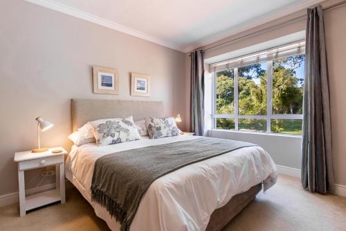 Ένα ή περισσότερα κρεβάτια σε δωμάτιο στο Coral Isle Apartment