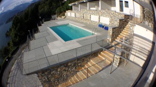 an aerial view of a house with a swimming pool at Residence Il Poggio in Dorio