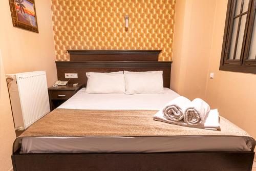 Postel nebo postele na pokoji v ubytování Pamuk City Hotel