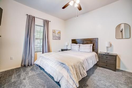 a bedroom with a large bed and a window at Midtown Modern Farmhouse in San Antonio