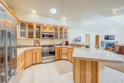 a kitchen with wooden cabinets and a white counter top at Totally Tahoe Townhome in Crystal Bay