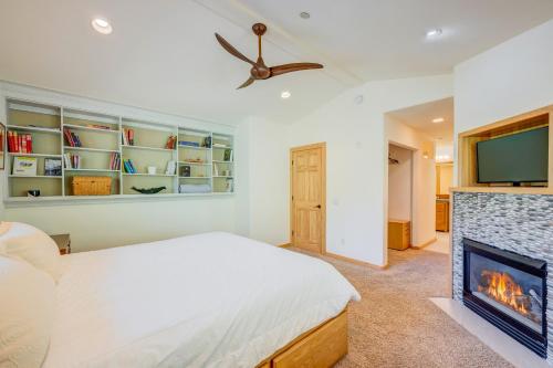 a bedroom with a bed and a fireplace at Totally Tahoe Townhome in Crystal Bay