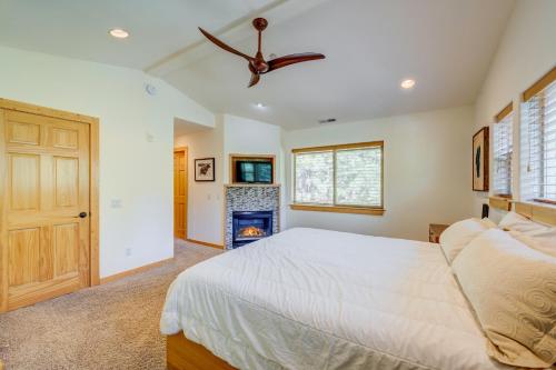 a bedroom with a bed and a ceiling fan at Totally Tahoe Townhome in Crystal Bay