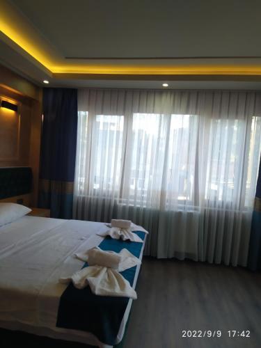 a hotel room with a bed with towels on it at THE MOSS Hotel in Istanbul