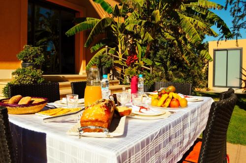 a table with a white table cloth with food on it at Villa Arabic House Pool & SPA, Marrakech in Marrakech