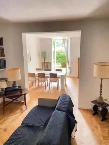 a living room with a couch and a table at Vagabunda Sea & Garden in Pesaro