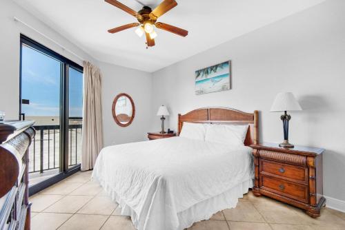 a bedroom with a bed and a ceiling fan at SunDestin 101 in Destin