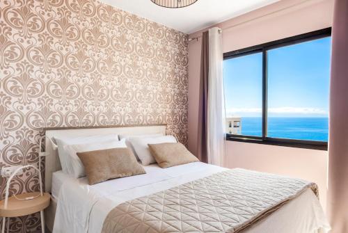 Postel nebo postele na pokoji v ubytování Ocean View Experience