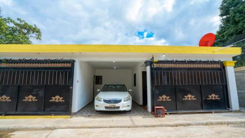 a car parked in the garage of a house at Peace By The River in Jarabacoa