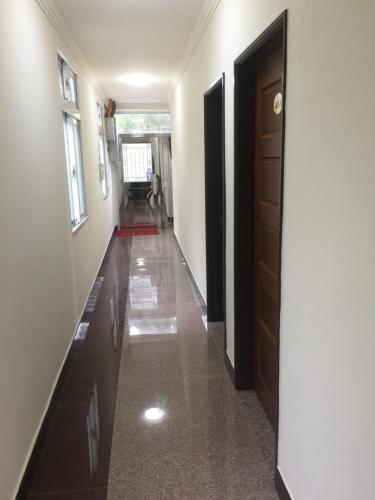 a hallway of a house with a door and a floor at Home run Homestay in Dongyin
