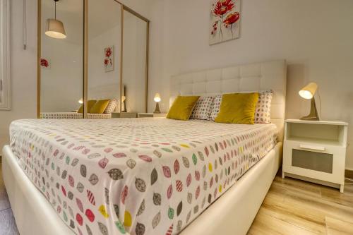 a bedroom with a large bed with a large mirror at Orlando - Ocean View Apartment in Costa Adeje in Adeje