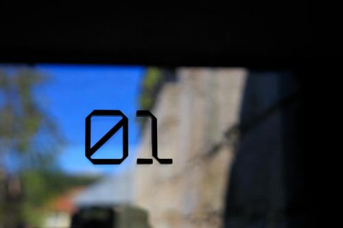 a blurry picture of the number one on a window at 108MM House in Porto