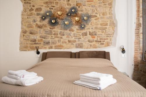 Krevet ili kreveti u jedinici u okviru objekta B&B Sotto le Mura