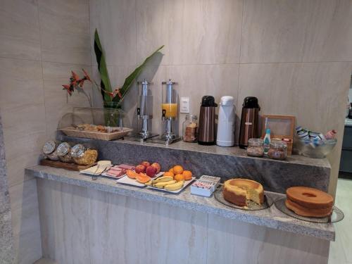 a buffet of food on a counter in a room at HOTEL CORTESE in Teresina