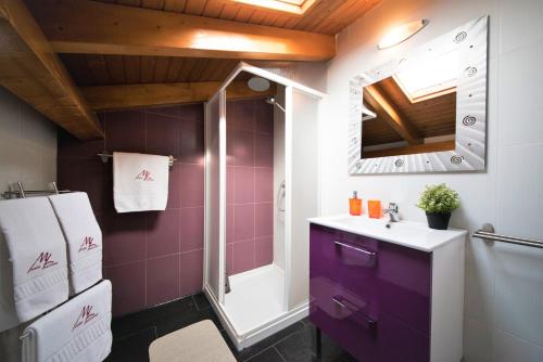 a bathroom with a purple sink and a shower at Monte Lusitano D'Vagar in Grândola