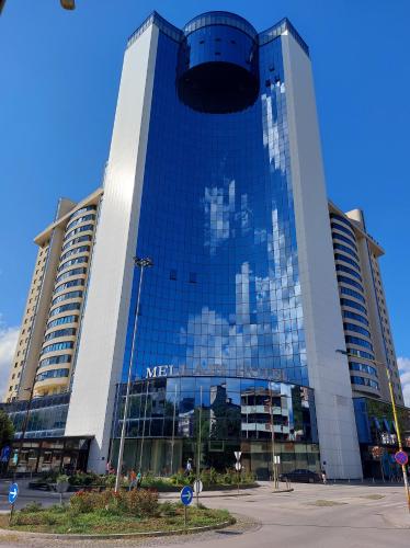 a large building with a lot of windows at Luxury Apartment Karic FREE parking in Tuzla