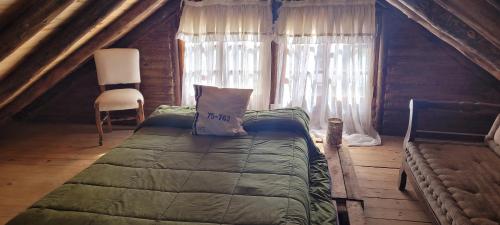 a bedroom with a bed and a window at ENTRE VIÑAS in Ciudad Lujan de Cuyo
