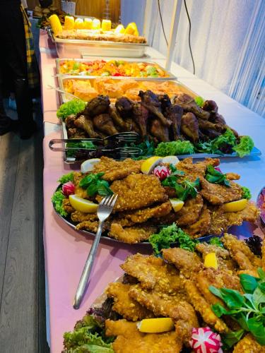 a buffet of different types of food on a table at Horský hotel Jelenovská s bazénem v ceně in Valašské Klobouky